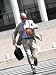 Businessman Running Across Street and Check the Time Photographic Poster Print, 12x16