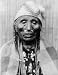 1910 photo Head-and-shoulders portrait of Tlakluit Indian woman, with bone in nose, facing front, Wa