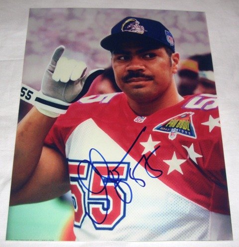 Junior Seau Autographed San Diego Chargers 8x10 Photo W/PROOF, Picture of Junior Signing For, San Diego Chargers, New England Patriots, Miami Dolphins, USC Trojans