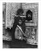 Historic Print (L): [Child, who is blind in one eye, seated on shoulder of woman and sucking sugar cane; and