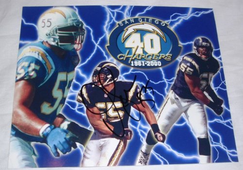 Junior Seau Autographed San Diego Chargers 8x10 Photo W/PROOF, Picture of Junior Signing For, San Diego Chargers, New England Patriots, Miami Dolphins, USC Trojans