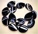 Black Sardonyx; Grade A; Twisted Ovals -30x22mm- 15.5 Strand