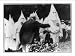 Historic Print (L): Presbyterian pastor in Klan robes praises Jewish merchant and Klan presents flowers to h