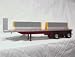 Spread Axle Flatbed with Load of Jersey Barriers