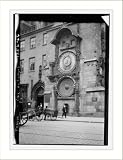 Photo (M): Fa�ade with clock of City Hall. Prague