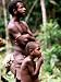 Man and Boy Watching Work, Oriomo Plateau, Western, Papua New Guinea Art Photographic Poster Print by Oliver Strewe, 12x16