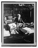 Historic Print (L): [Andrew Carnegie, 1835-1919, half length, seated behind desk, looking down at book, faci