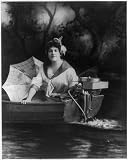Young woman posed with Evinrude outboard motor,c1913 Young woman posed with Evinrude outboard motor,c1913