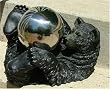 Black Lying Bear with Silver Stainless Steel Gazing Globe