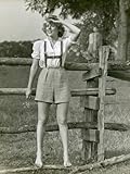 Woman Standing on Fence Looking Off Photographic Poster Print by George Marks, 12x16