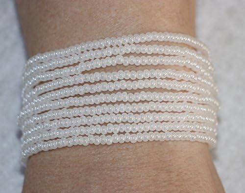 1136. 10 strand white seed bead bracelet with a slide tube clasp.