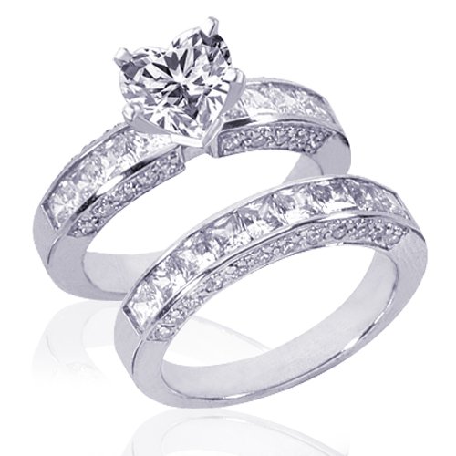 This 14 karat white gold Vintage style engagement wedding rings set has princess cut diamonds channel set and round diamonds pave set on either side of the ring and the band.  It is also available in 18 karat and platinum. ...