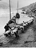 2 Rows of Chinese Trackers Plodding Along Bank of Yangtze River Towing a Junk Slowly Up River Photographic Poster Print by Dmitri Kessel, 18x24