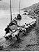 2 Rows of Chinese Trackers Plodding Along Bank of Yangtze River Towing a Junk Slowly ...