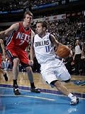 New Jersey Nets v Dallas Mavericks: Jose Juan Barea and Troy Murphy Photographic Poster Print by Danny Bollinger, 30x40