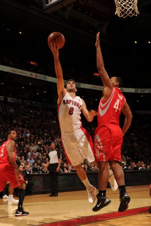 Houston Rockets v Toronto Raptors: Jose Calderon and Chuck Hayes Photographic Poster Print by Ron Turenne, 24x36