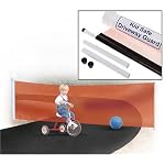 Driveway safety gate, showing boy driving bicycle on driveway with ball and safety net