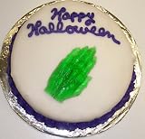 Carrot Decorated Cake Single Layer 8 Round Topped with Gummie Witch Hand Purple Trim