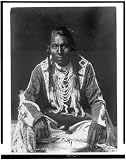 Wades in Water,Pigeon Indian,beaded buckskin shirt,leggings,braids,beads,c1910