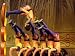 An Acrobat Dives Through a Hoop and Lands on Others in Headstands Photographic Poster...