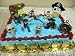 Exclusive, Unique, Nintendo Wii Pirates Of The Caribbean 16 Piece Disney Birthday Cake Topper Featuring Jack Sparrow, Captain Barbossa, Will Turner, Davy Jones, The Dog, Skeleton Pirate, Skull, Pirate Compass, 6 Pirate Gold Coins, Decorative Pirate Treasure Chest and Decorative Pirate Head