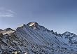 Long's Peak showing Trough Couloir during winter. Pagoda Mountain on the right - 16"x20" Photographic Print by Brendan Reals