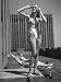 Model Wearing Sunglasses and Swim Suit Sunbathing on Roof of Rockefeller Center Photographic Poster Print by Alfred Eisenstaedt, 12x16