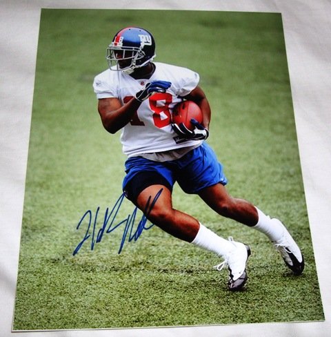 Hakeem Nicks Autographed New York Giants 8x10 Photo W/PROOF, Picture of Hakeem Signing For, New York Giants, North Carolina Tar Heels