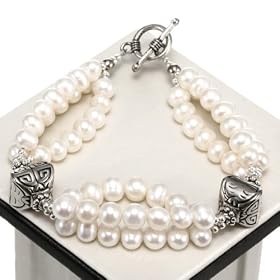 Handmade Three-Strand Pearl Bracelet with Silver Detail