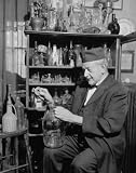 1939 Collecting old bottles is hobby of retired profes PHOTO