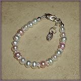 Addie Sterling Silver Childrens Girls Bracelet Jewelry NEW! Gorgeous freshwater pearl bracelet with beautiful white and pink pearls accented with sparkling silver daisies. This is a timeless keepsake! Size Medium 1-5 Years