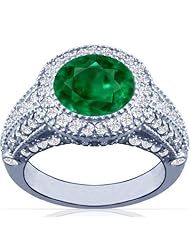 Platinum Round Cut Emerald Ring With Sidestones