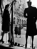 Elegantly dressed Women on Corner of Fifth Avenue and 58th in front of Window of Bergdorf Goodman Photographic Poster Print by Alfred Eisenstaedt, 12x16