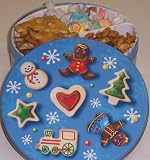 Scott's Cakes Taffy, Peanut and Pretzel Brittle, and Sassy Peanut Combo in a Christmas Cookie Tin