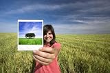Young Woman Smiling Holding Single Polaroid Film Strip - 48