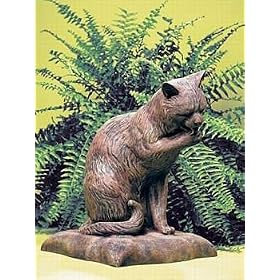 Cat Licking Paw on a Pillow Garden Statue by 