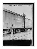 Newswire Photo (S): Tramp climbing on railroad car