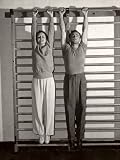 Health Club Owner Terry Hunt, Trainer of Movie Stars, Hanging from Horizontal Bars with Mary Astor People Premium Photographic Poster Print by George Strock, 18x24
