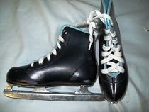 BLACK DOUBLE RUNNER ICE SKATES - SIZE IS 12J (child) - good condition - used only a couple of time