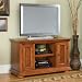 Home Styles Homestead TV Stand in Distressed Warm Oak Finish