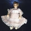 Dollhouse Miniature Porcelain Girl Doll in a Pink Dress