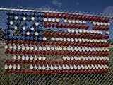 A Makeshift American Flag of Plastic Cups Decorates a Fence Photographic Poster Print by Stephen St. John, 12x16