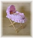 Pink B A Toys moses basket And Stand