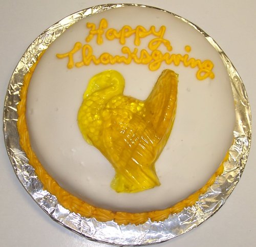 Raspberry Decorated Cake Single Layer 8 Round Topped with Gummie Turkey Golden Yellow Trim by Scott's Cakes