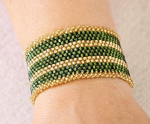 1098. Bead woven bright green and gold cuff bracelet with a slide tube clasp.