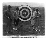 Historic Print (S): 4 girls of Marjorie Webster school examining archery target - Louise Walraven, Imogene K