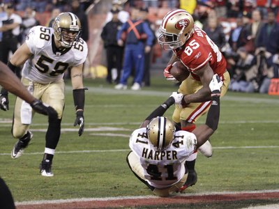 San Francisco 49ers and New Orleans Saints: Vernon Davis and Roman Harper Photographic Poster Print by Paul Sakuma, 32x24