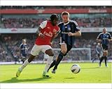 Photographic Prints of Gervinho (Arsenal) Matthew Upson (Stoke). Arsenal 3 1 Stoke City. Barclays from Arsenal FC Prints
