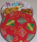 Scott's Cakes Taffy, Peanut and Pretzel Brittle, and Peanut Butter Pretzel Nuggets Combo in a Christmas Present Tin