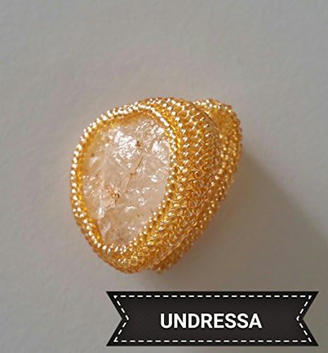 Spectacular ring designed with Japanese beads with gold coating and CaesarStone in natural coloring. Brand new.